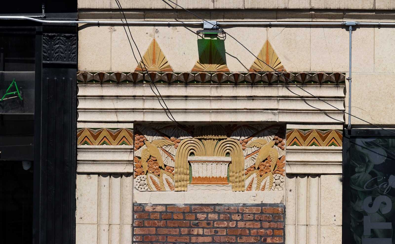 brooklyn - art deco terra cotta doorway with birds, geometric and foliate ornament