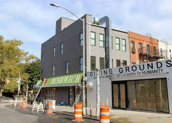 green awning on the side facade