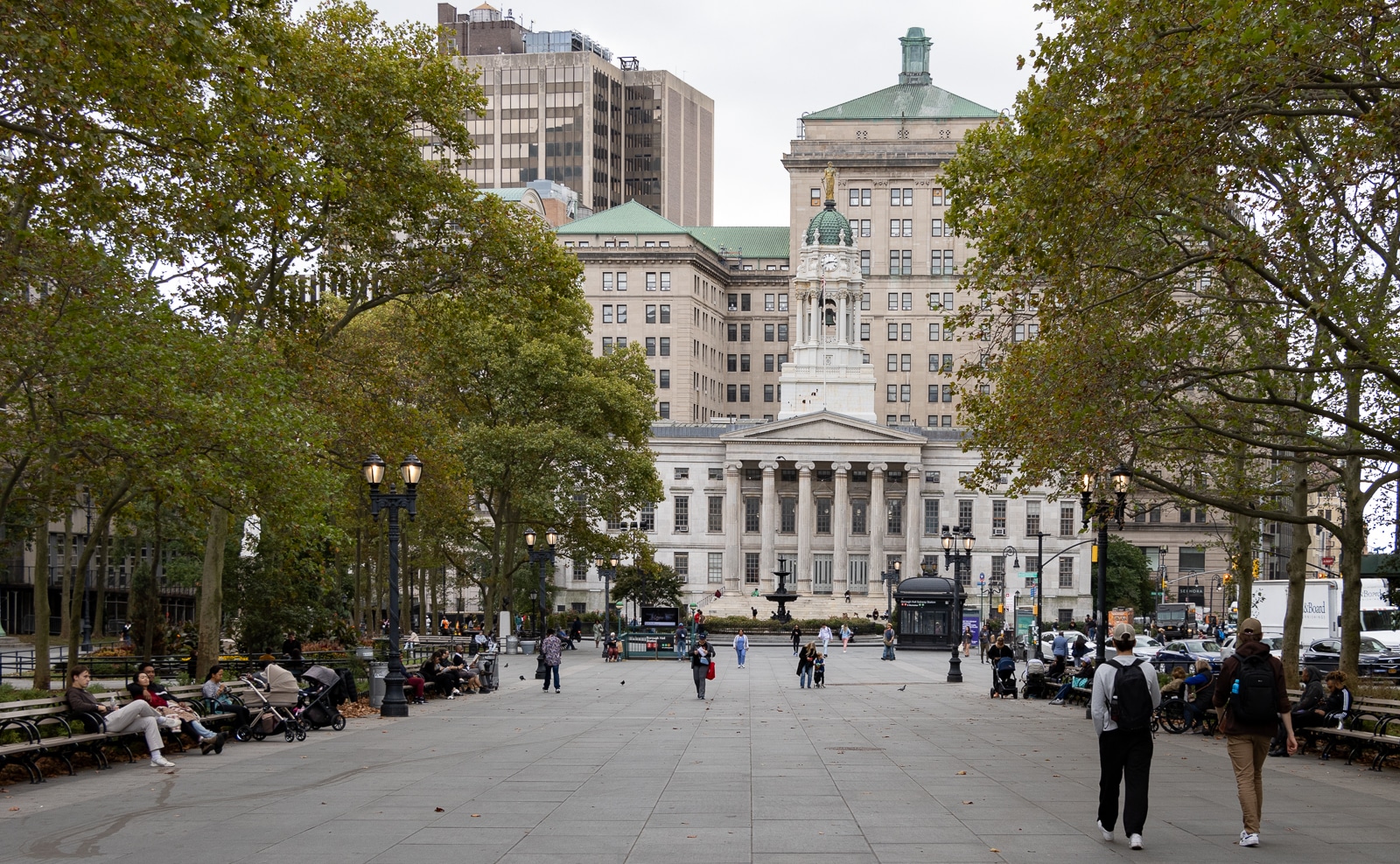 Brooklyn - people walking through Columbus Park with a view of Borough Hall