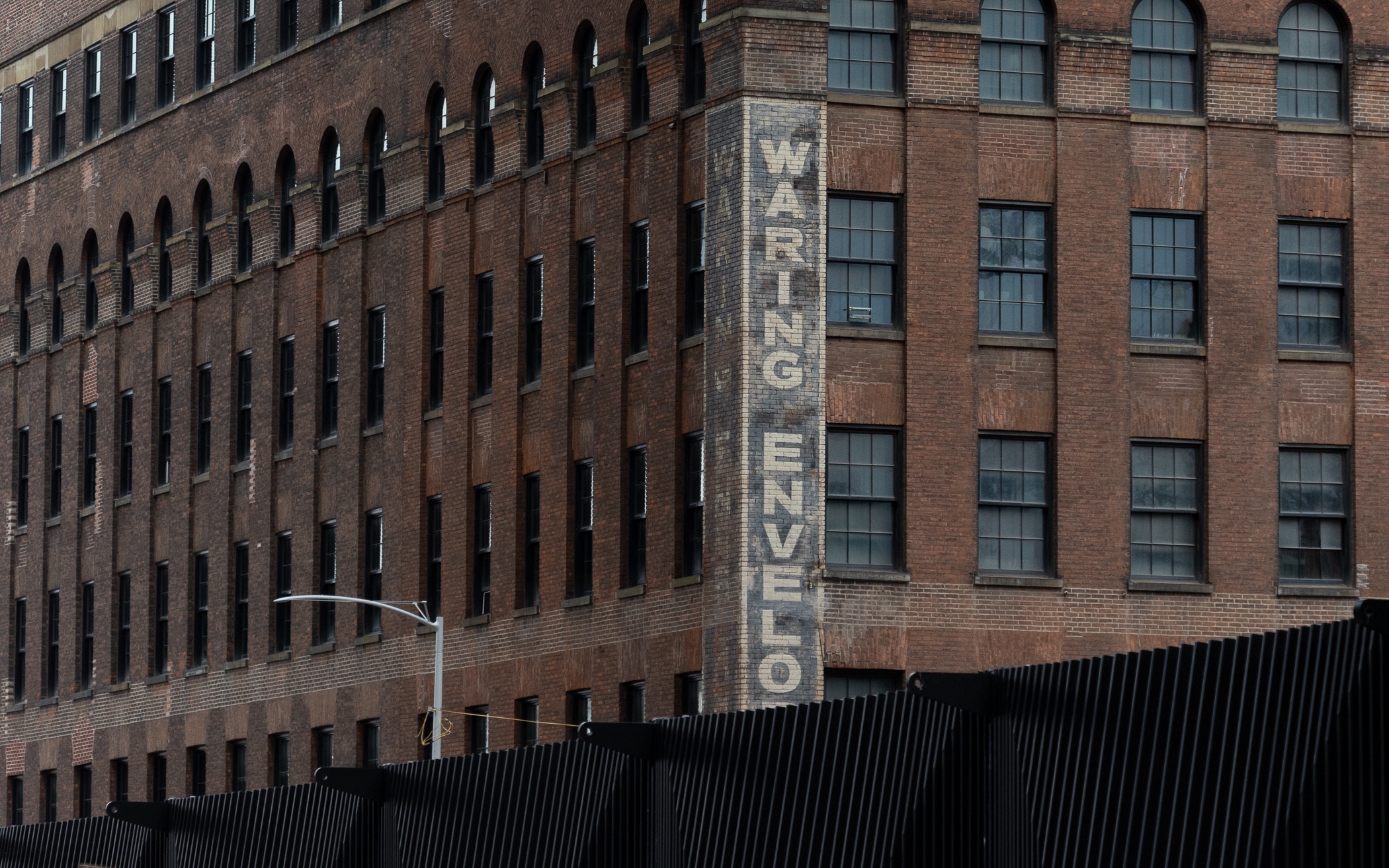 brooklyn - brick industrial building with waring envelope painted sign