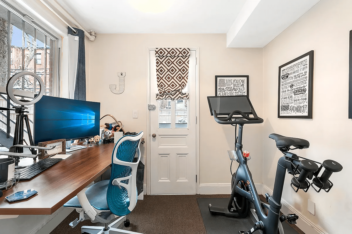 office at rear of garden apartment with door to the garden