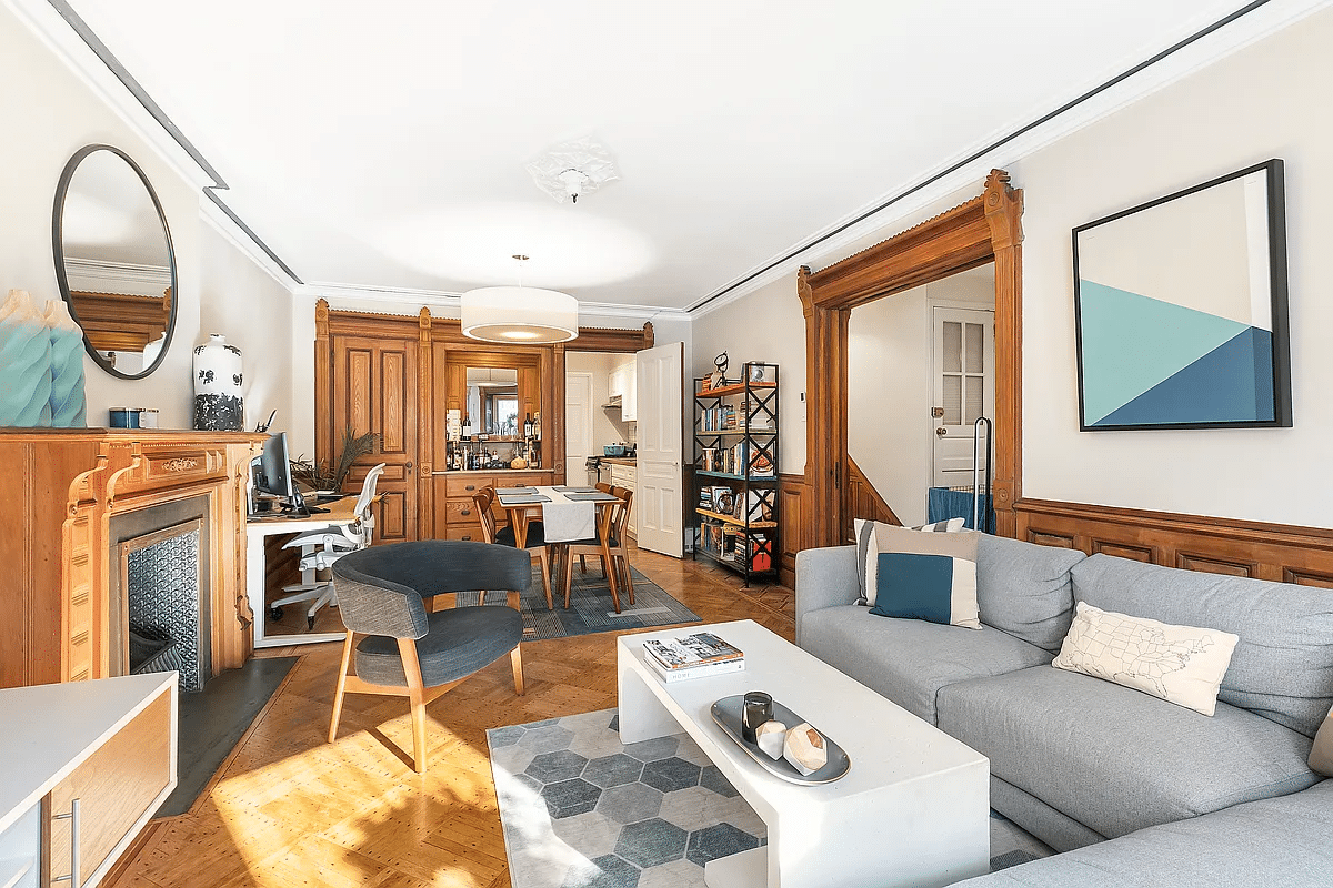 garden apartment with wainscoting, mantel, virtually staged furniture