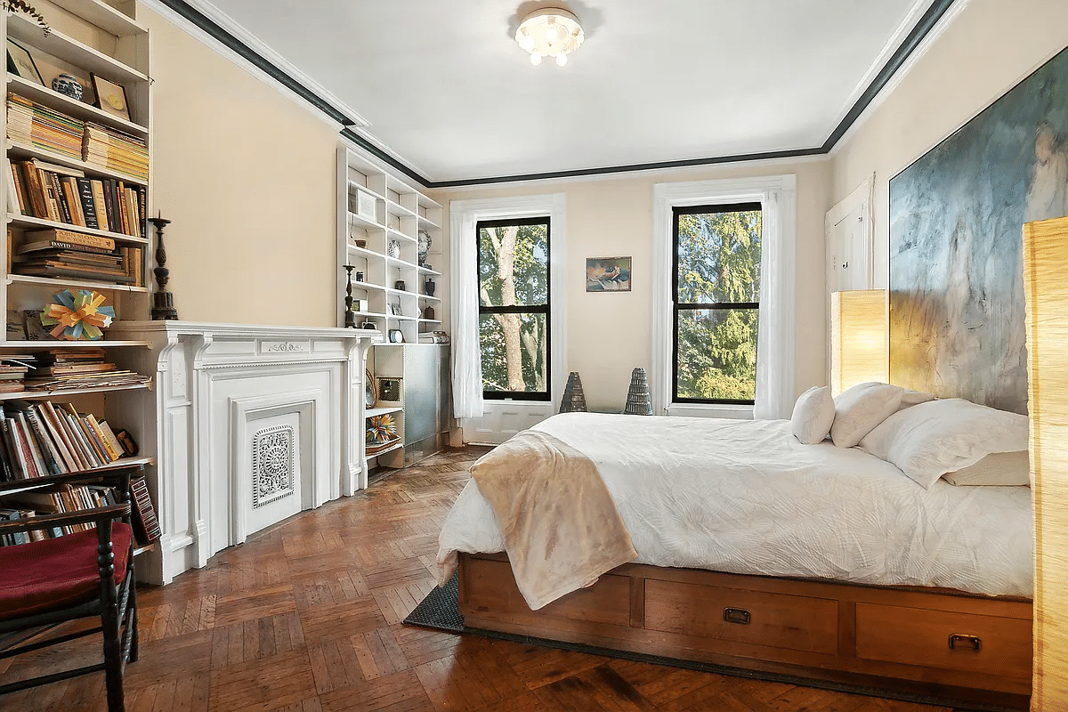 top floor bedroom with built-in bookshelves