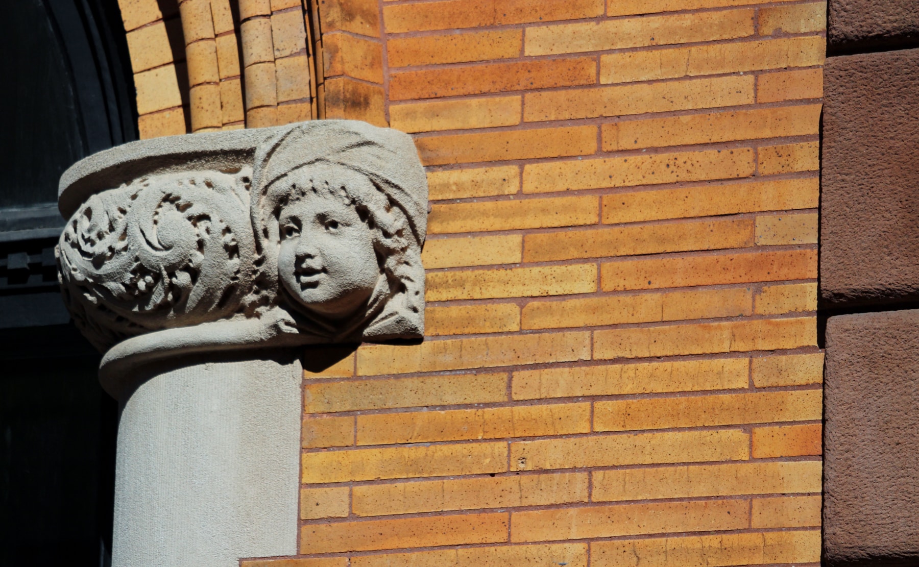 brooklyn - detail of brickwork and and ornament, including a face, on a rowhouse in park slope