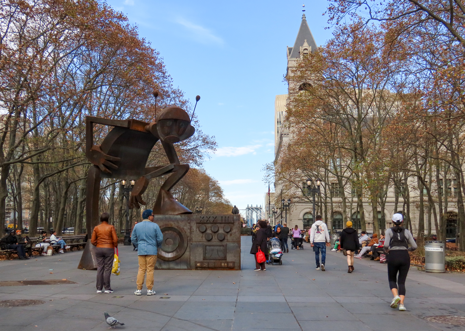 brooklyn - cadman plaza with pedestrians walking by the "Rappin' Max Robot" sculpture