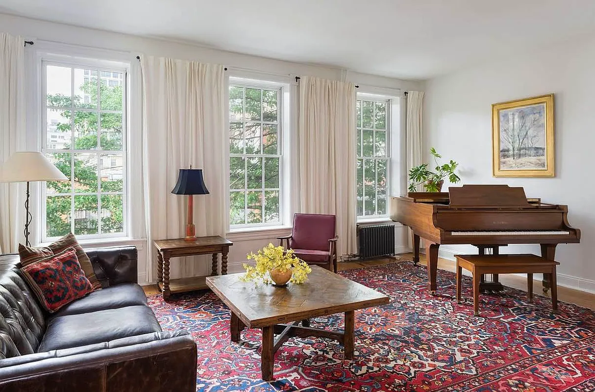 prospect heights -living room with three windows, white walls,