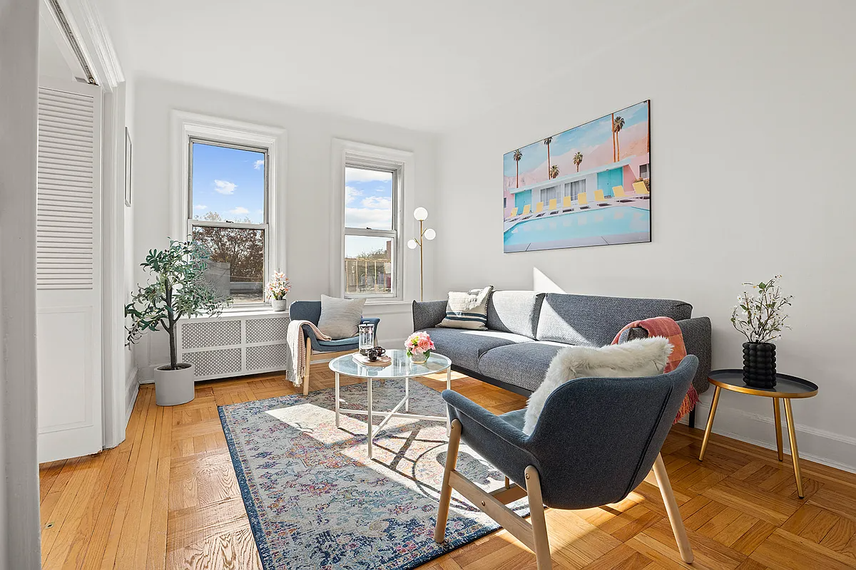 living room with two windows, parquet floor