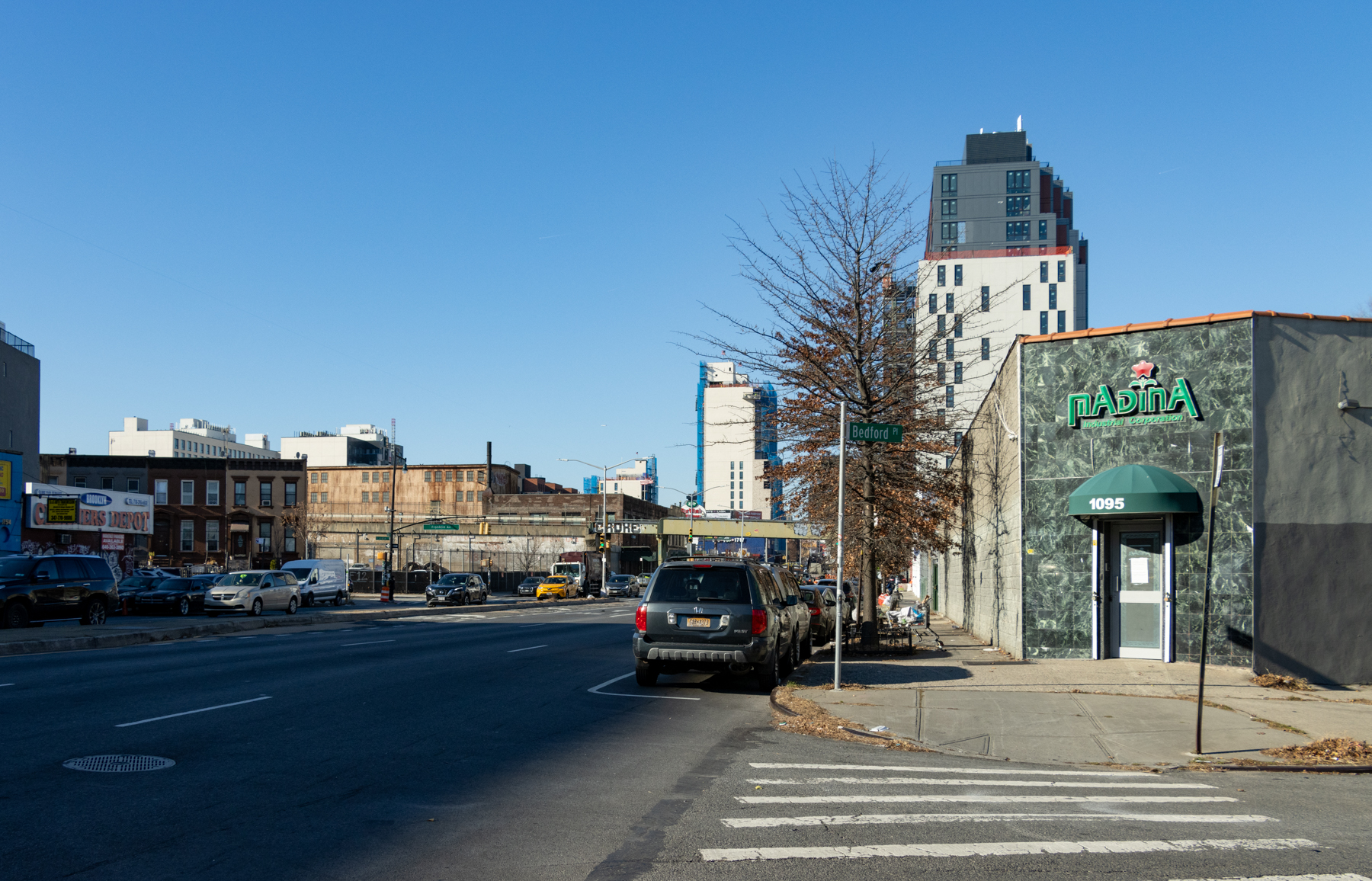 a view on atlantic avenue with elevated rail in the distance