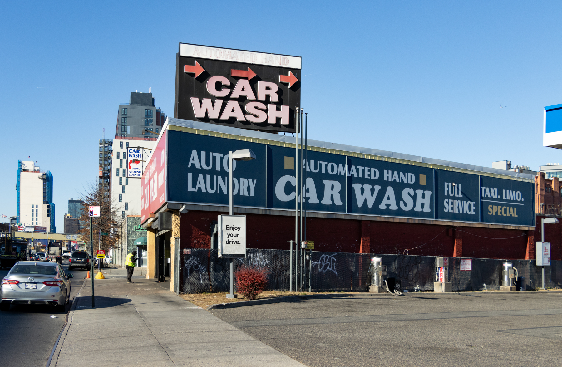 a car wash with large signs on atlantic avenue