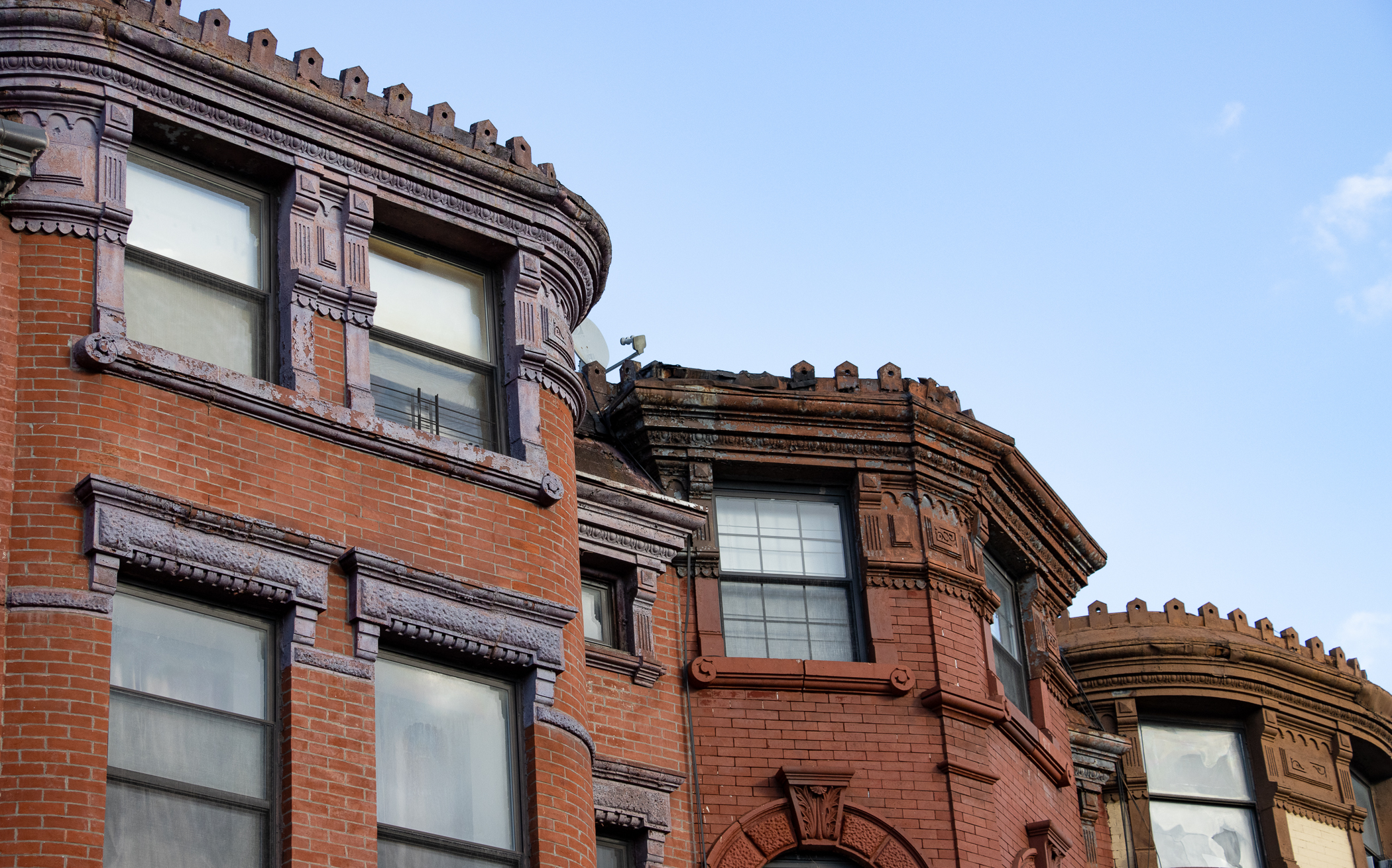 brooklyn - cornices on brick houses on bushwick avenue