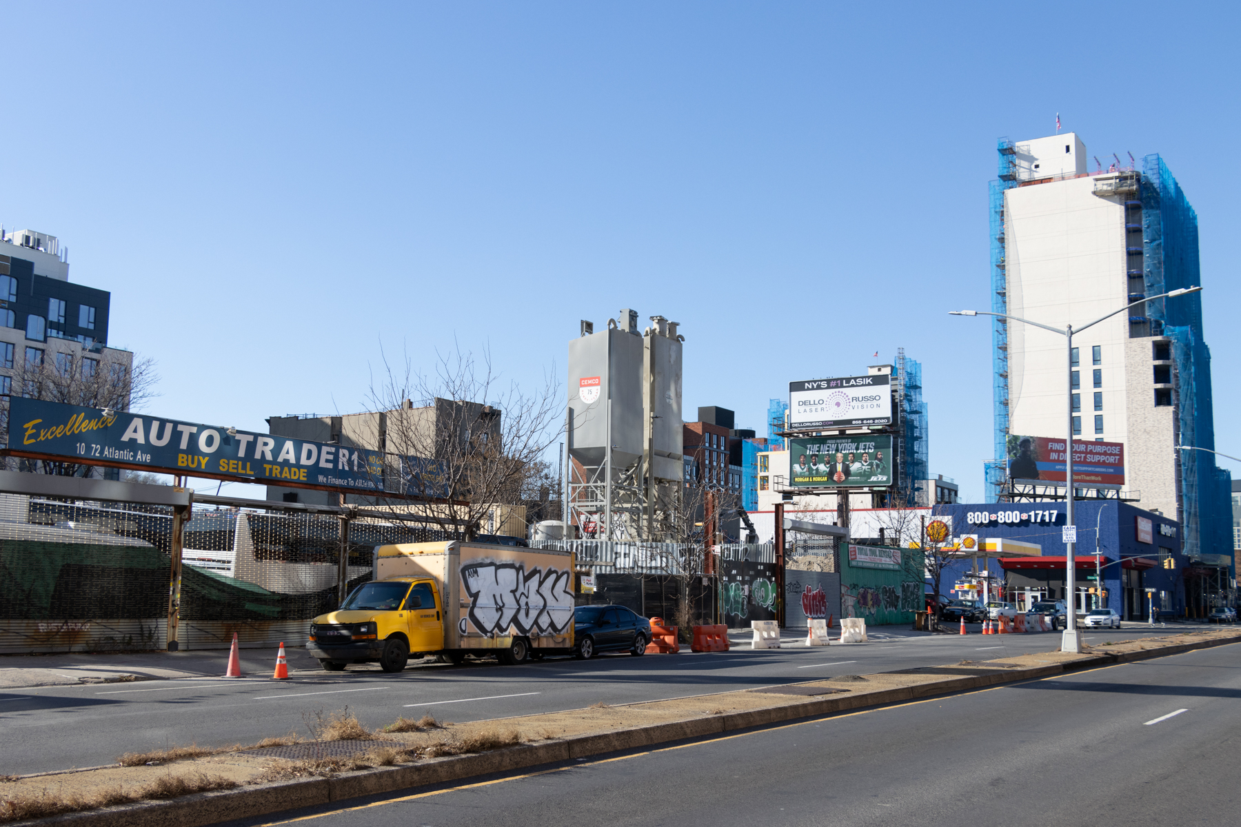 atlantic avenue near classon showing auto dealers, gas stations and other service businesses with new construction in the background