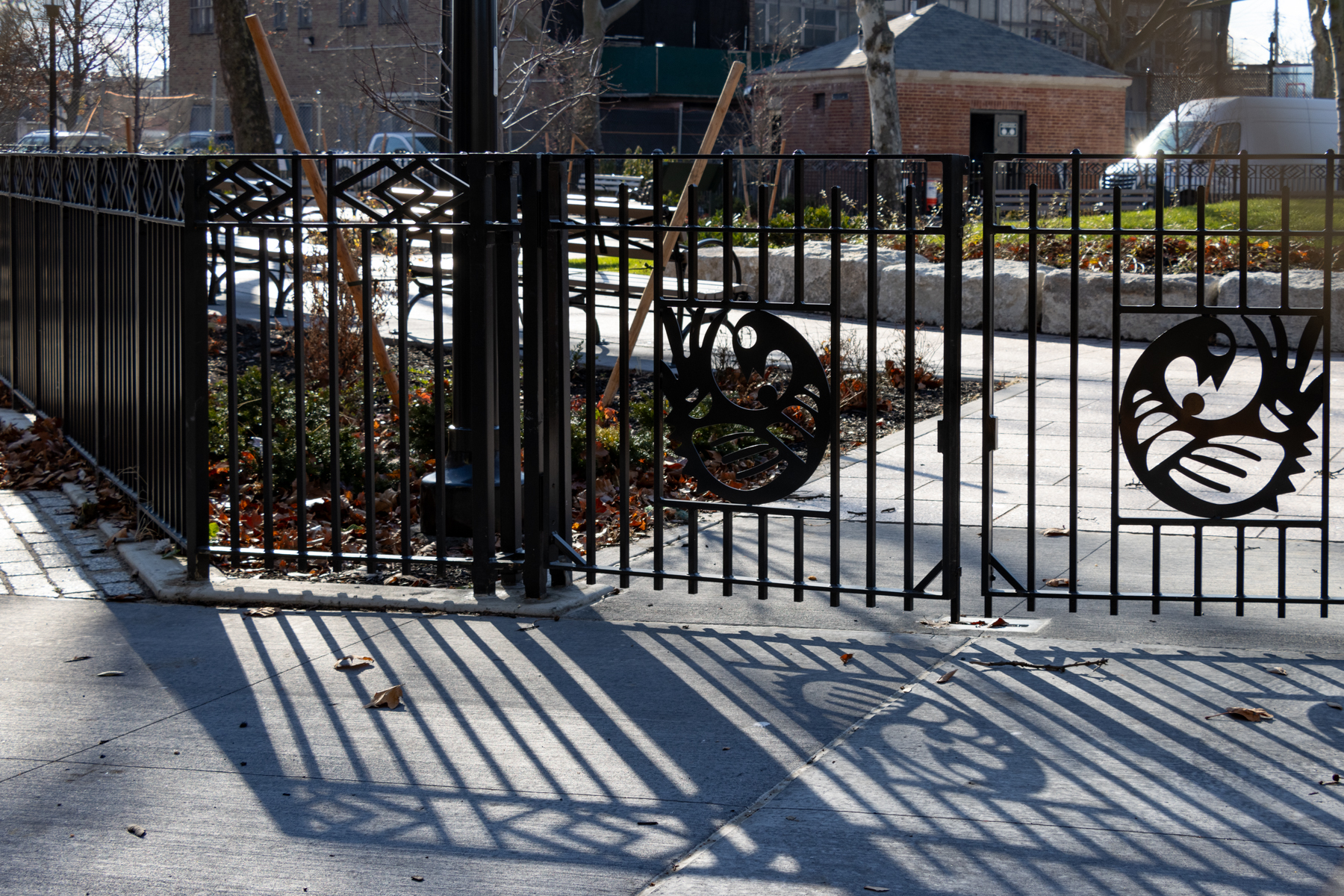 new fencing in the park with bird imagery in the gates