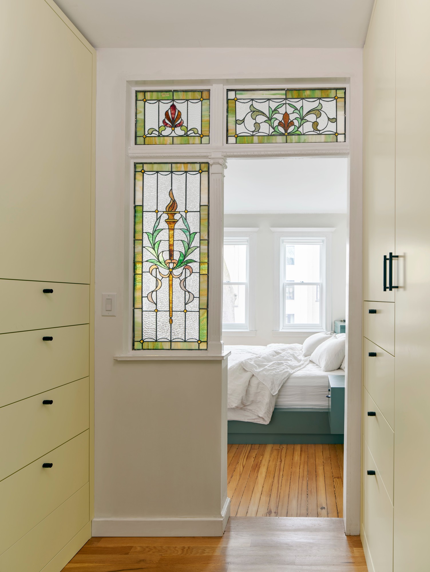 STAINED GLASS DOORWAY TO PRIMARY BEDROOM
