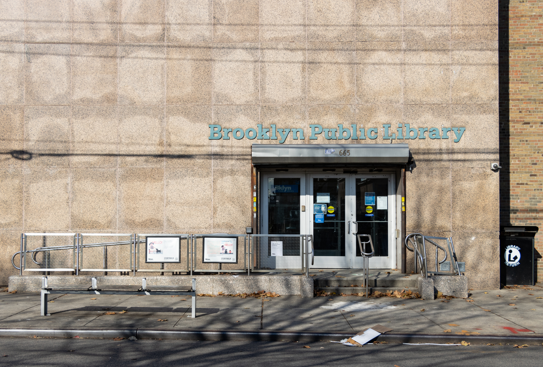 entrance to the new lots library with "brooklyn public library" on the outside and an accessible ramp