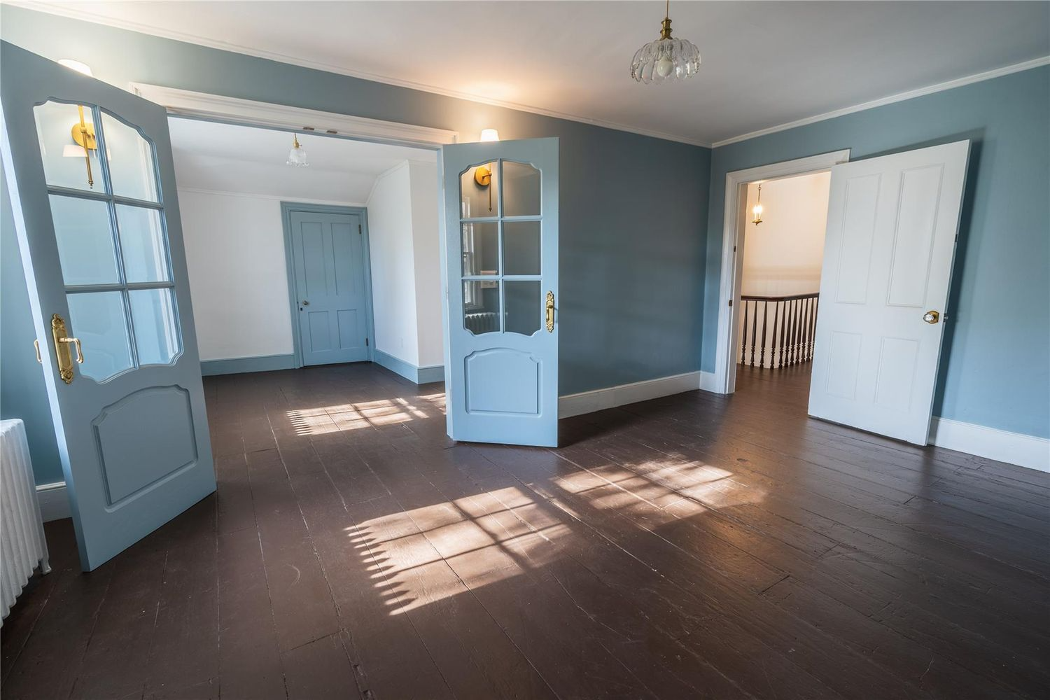 room with blue walls, french doors