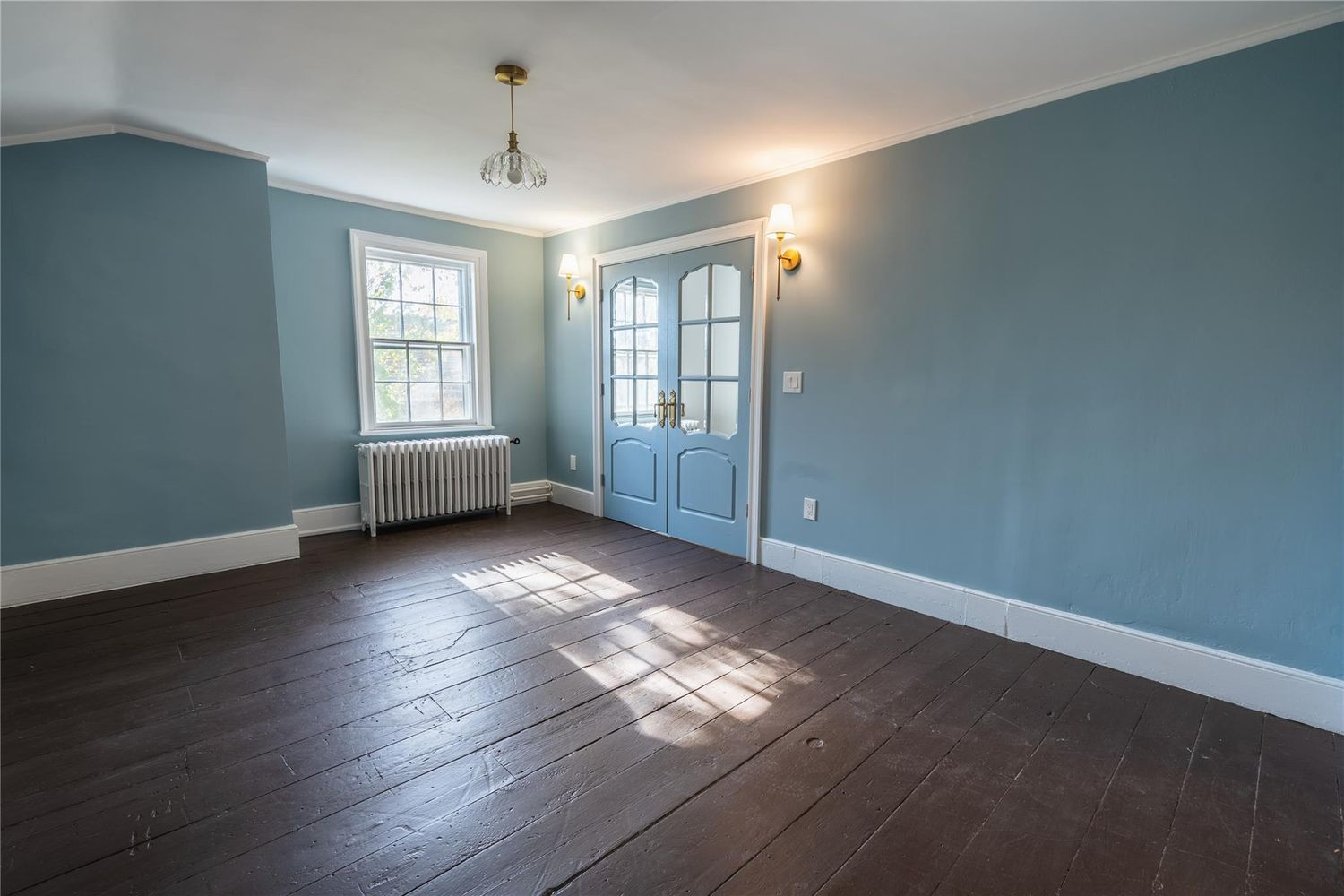 room with blue walls, french doors