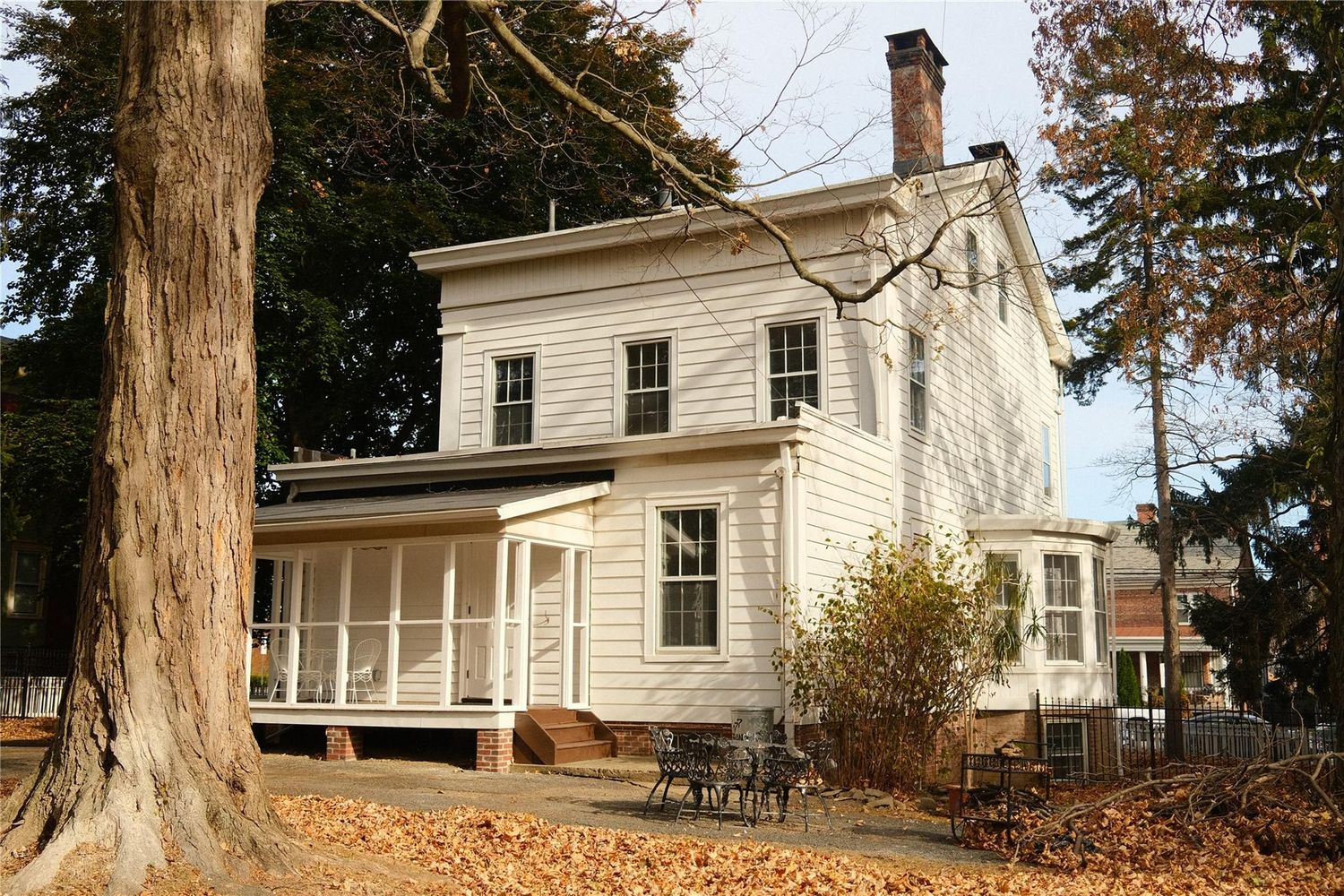 rear of the house with enclosed porch