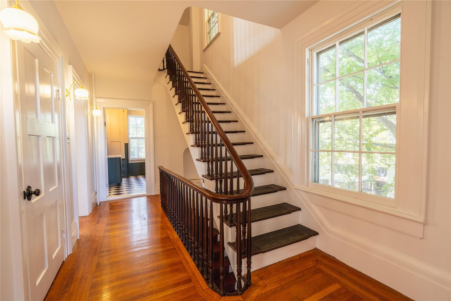 second floor stair hall with curved railing