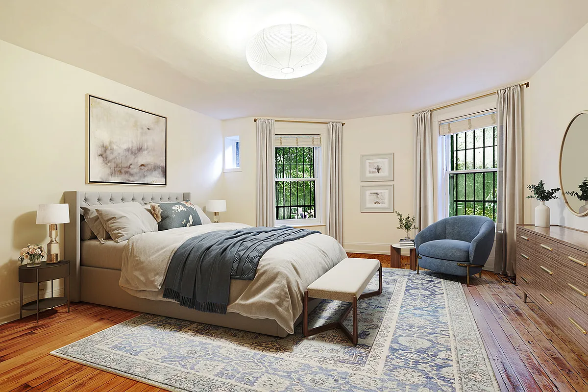 virtually staged bedroom with dresser, bed and seating area