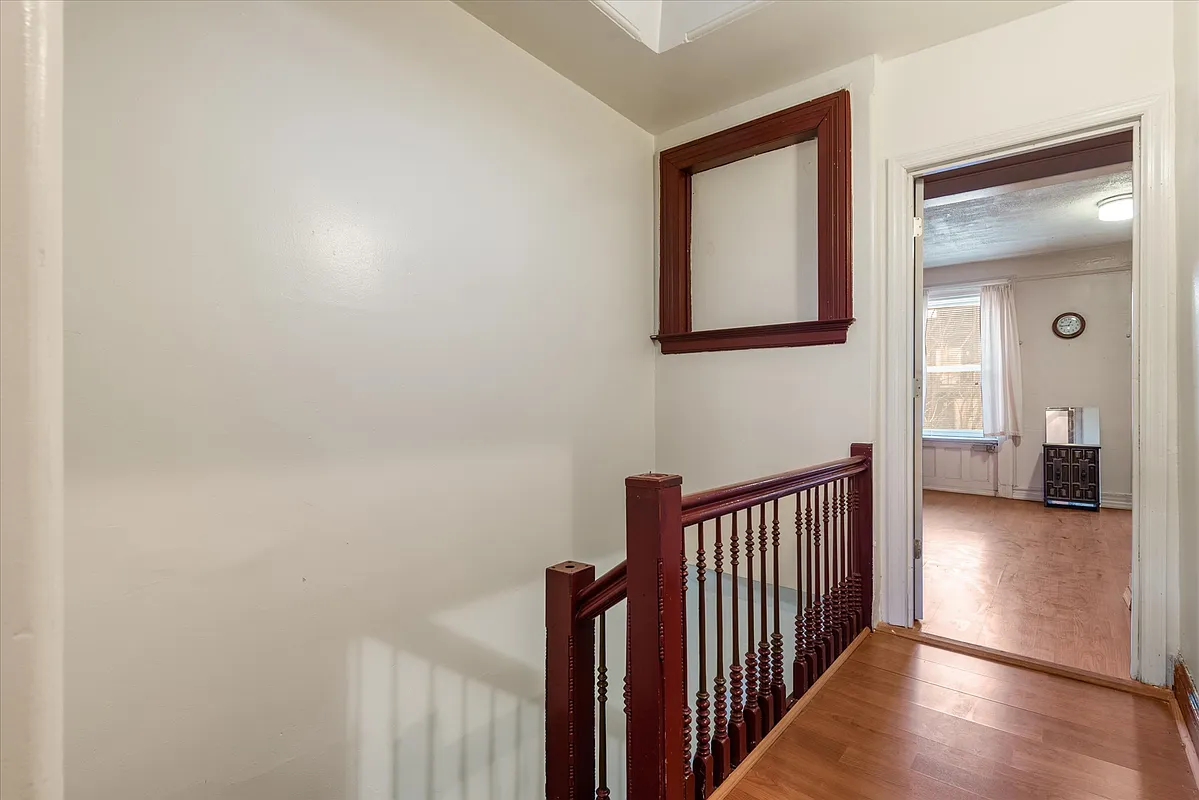 upstairs landing with view into a bedroom