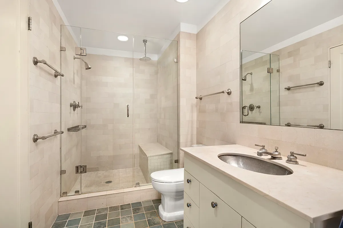 bathroom with glass doors to shower