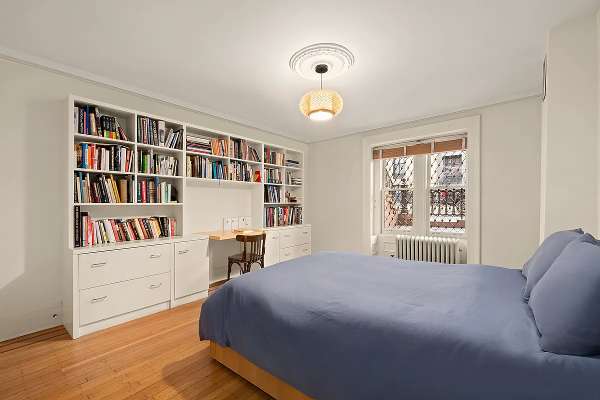 garden level bedroom with wood floor