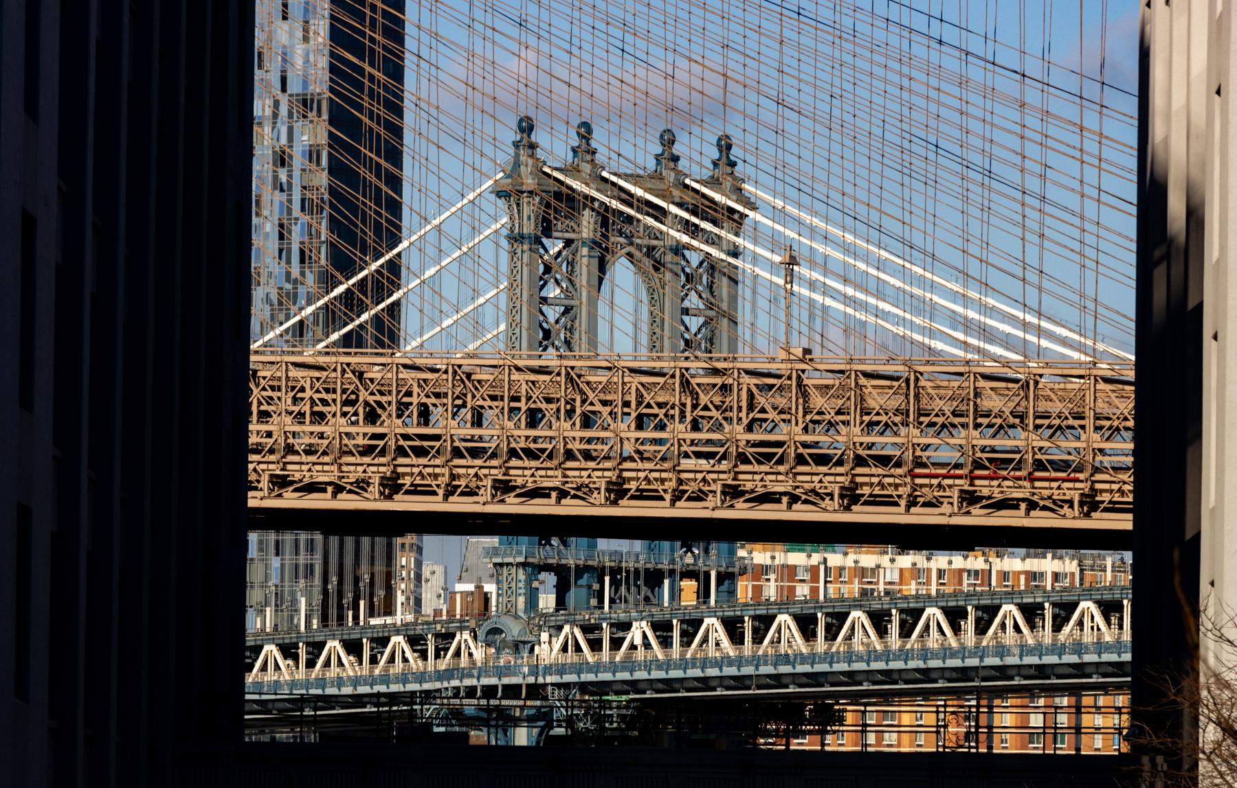 brooklyn - a view on furman street showing the manhattan bridge as seen through the cables of the brooklyn bridge