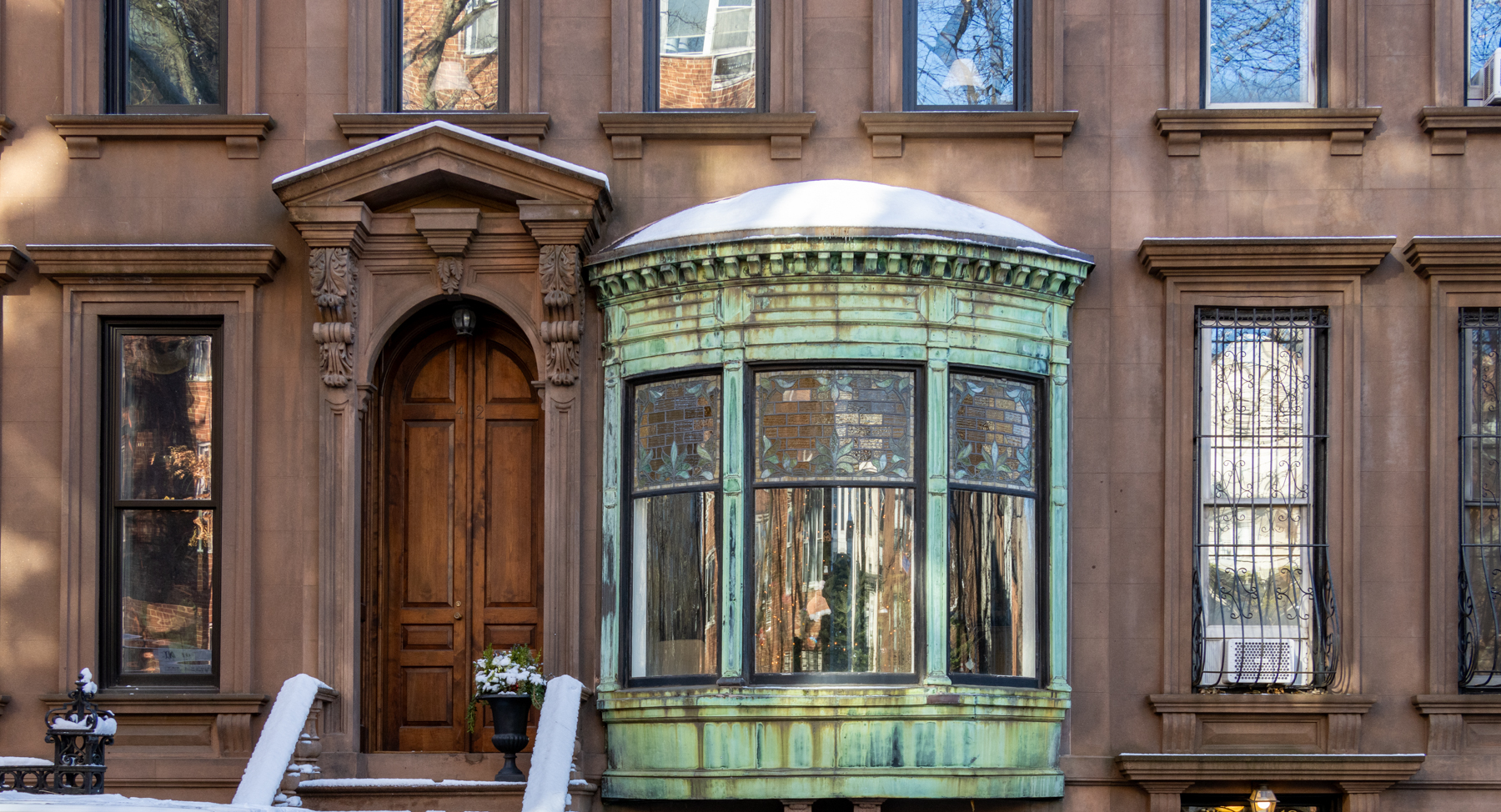 brooklyn - snow atop a brownstone stoop and oriel window
