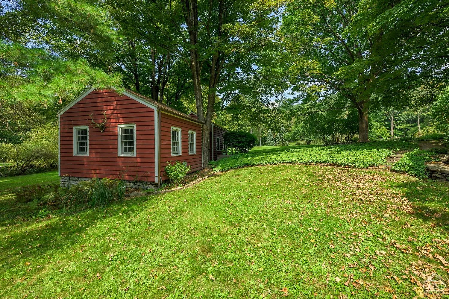 red frame exterior of the guest cottage
