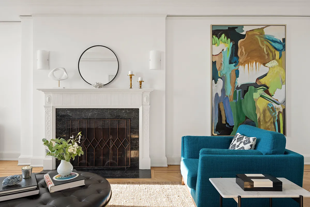 living room mantel with black marble surround