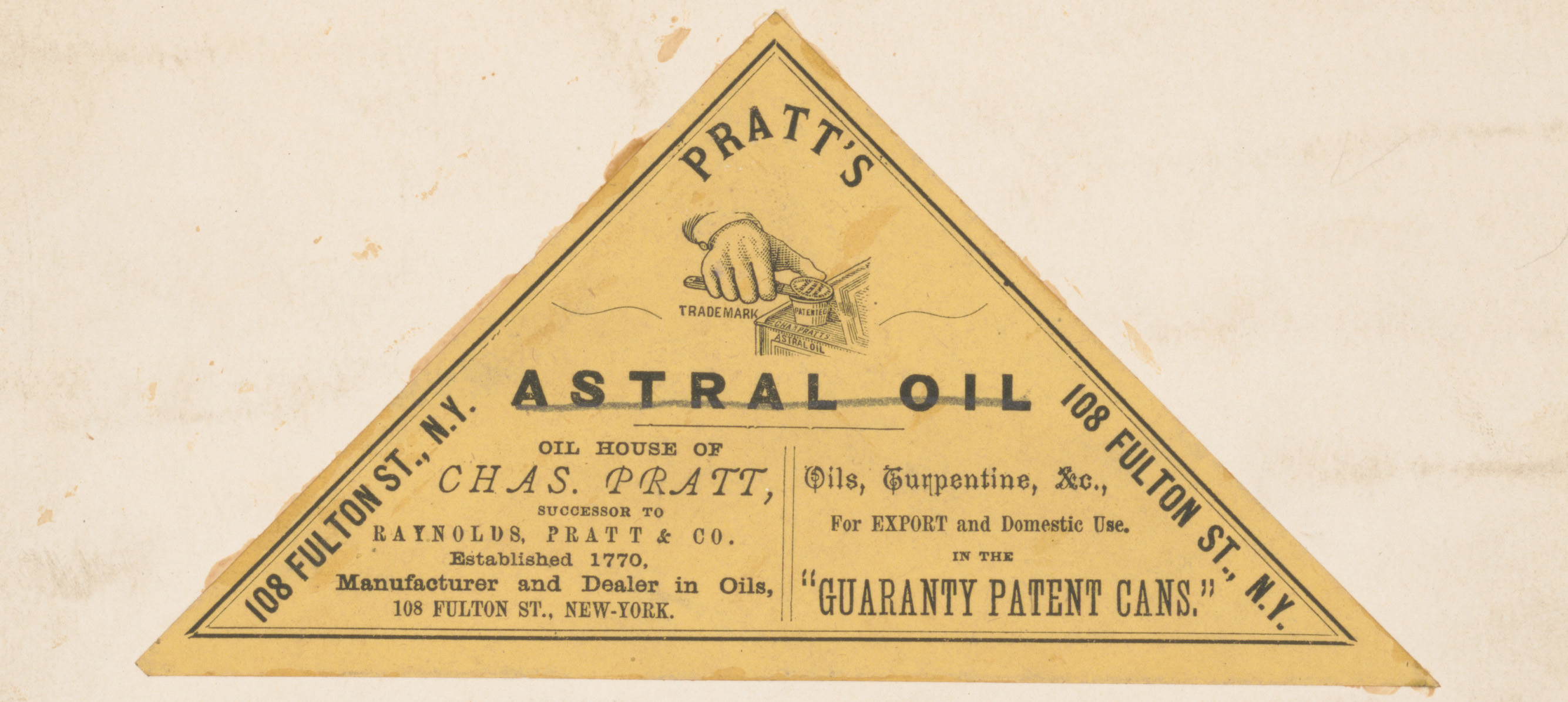 yellow triangle with astral oil text