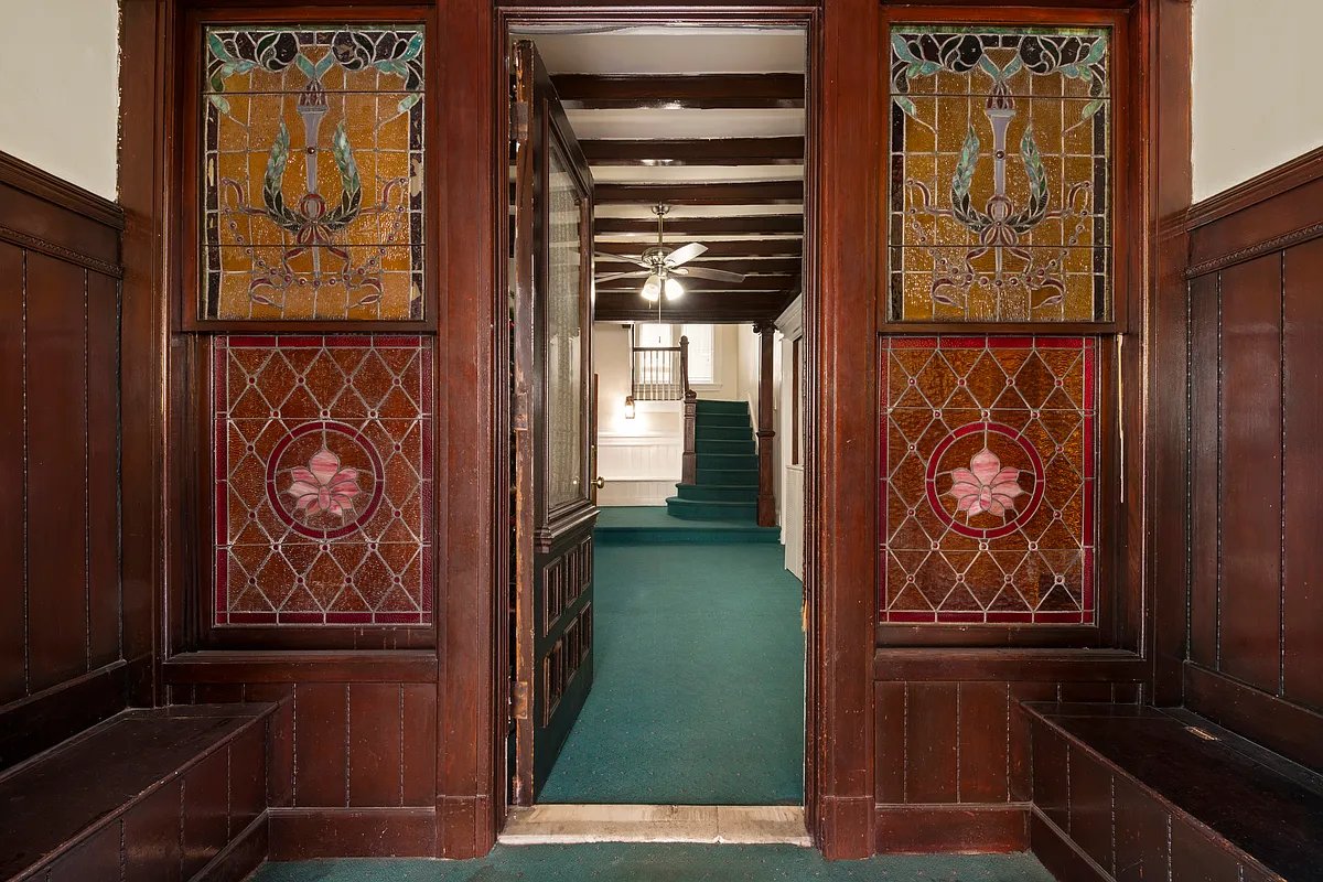 vestibule with stained glass and built-in benches