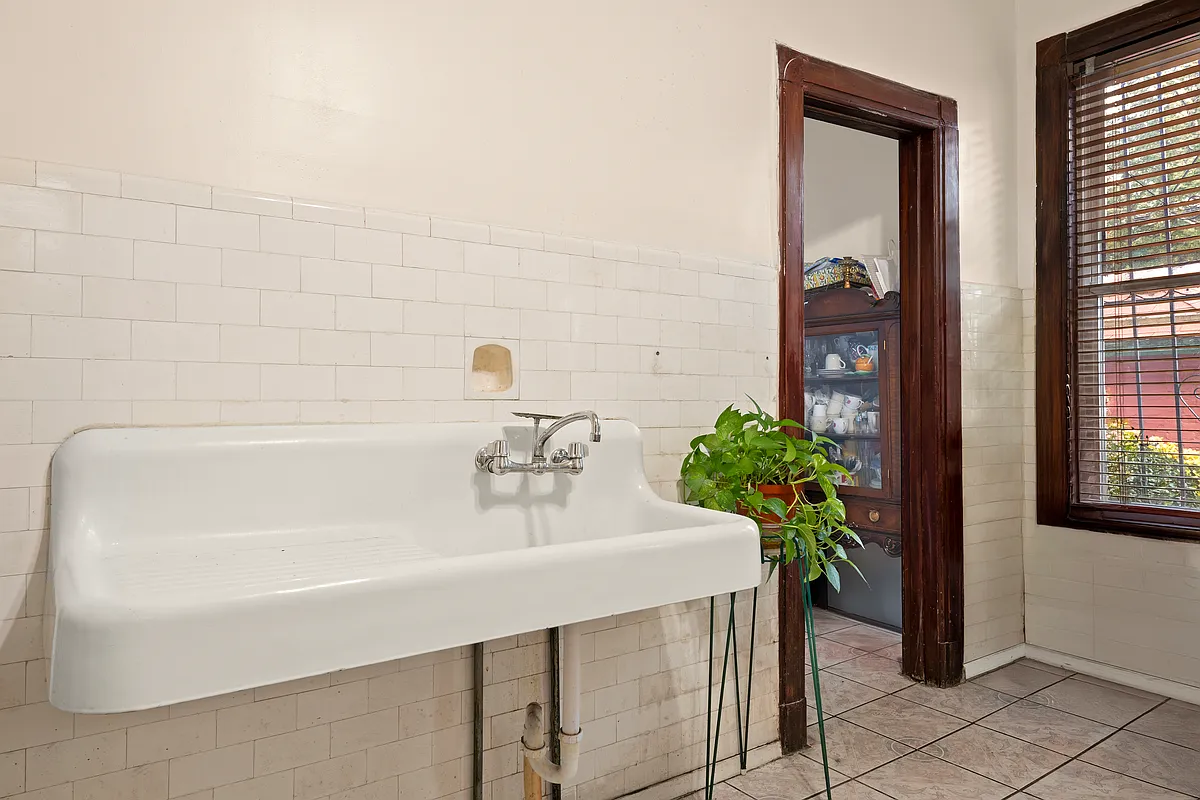 kitchen with vintage wall hung sink, subway tile on walls