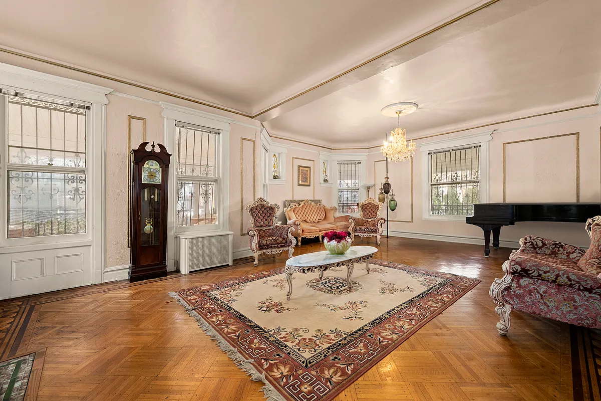 parlor with wall moldings, picture rail, stained glass, wood floor