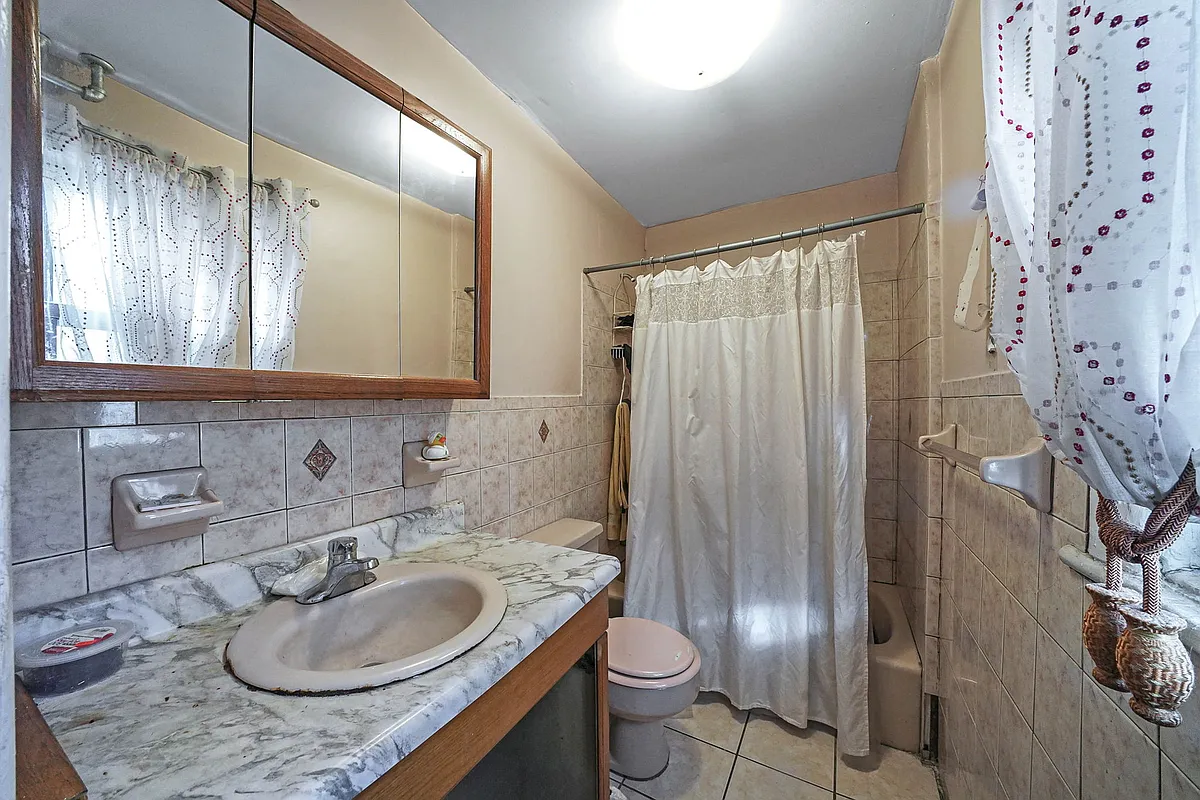 bathroom with beige tile