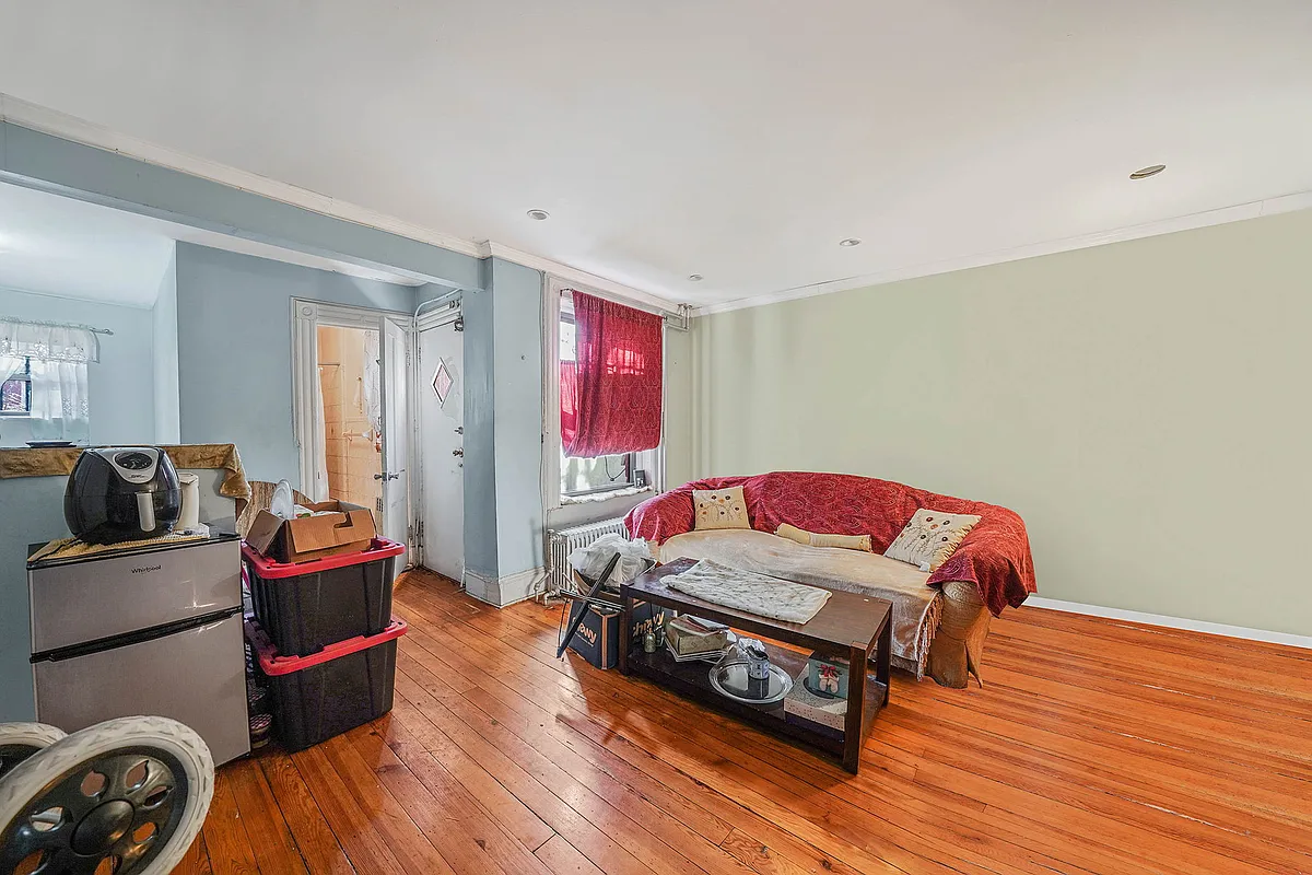 living room in garden apartment with wood floors, recessed lighting