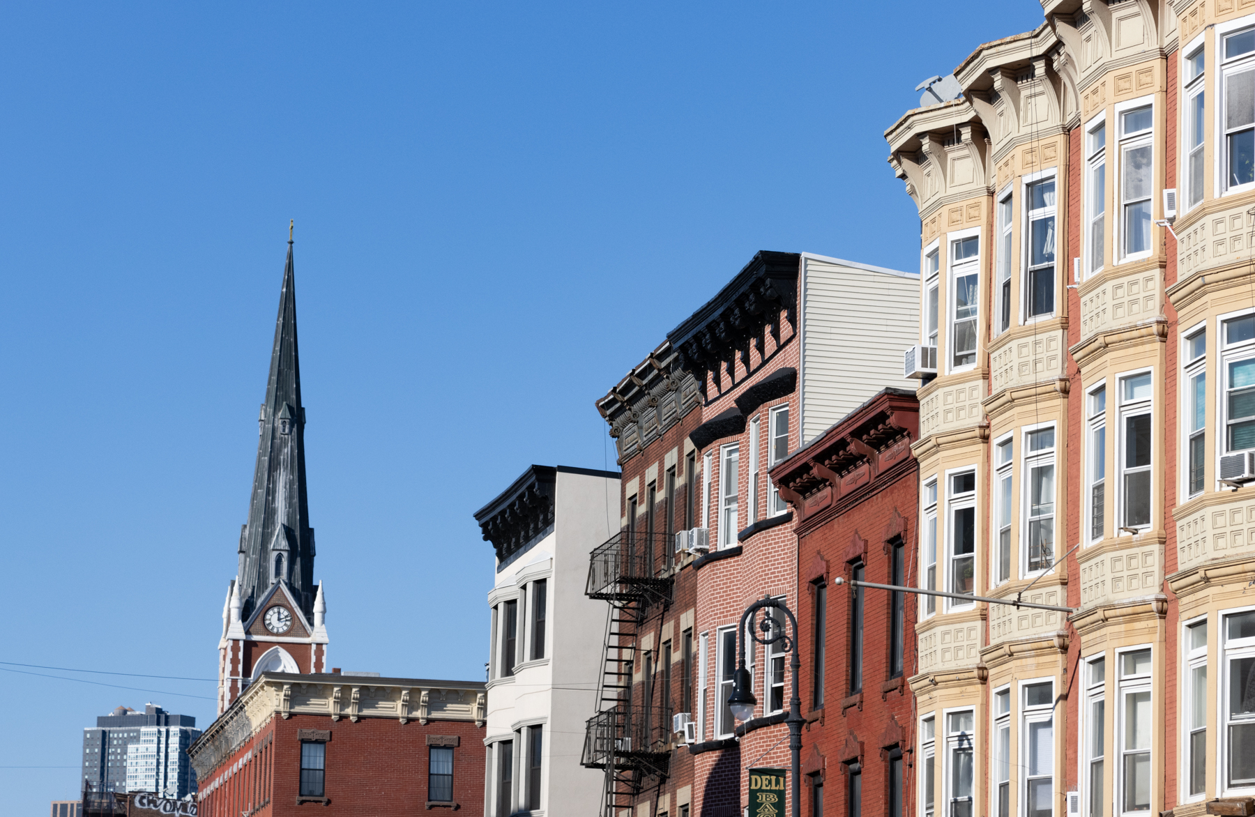 brooklyn - cornices and a church steeple on manhattan avenue in Greenpoint