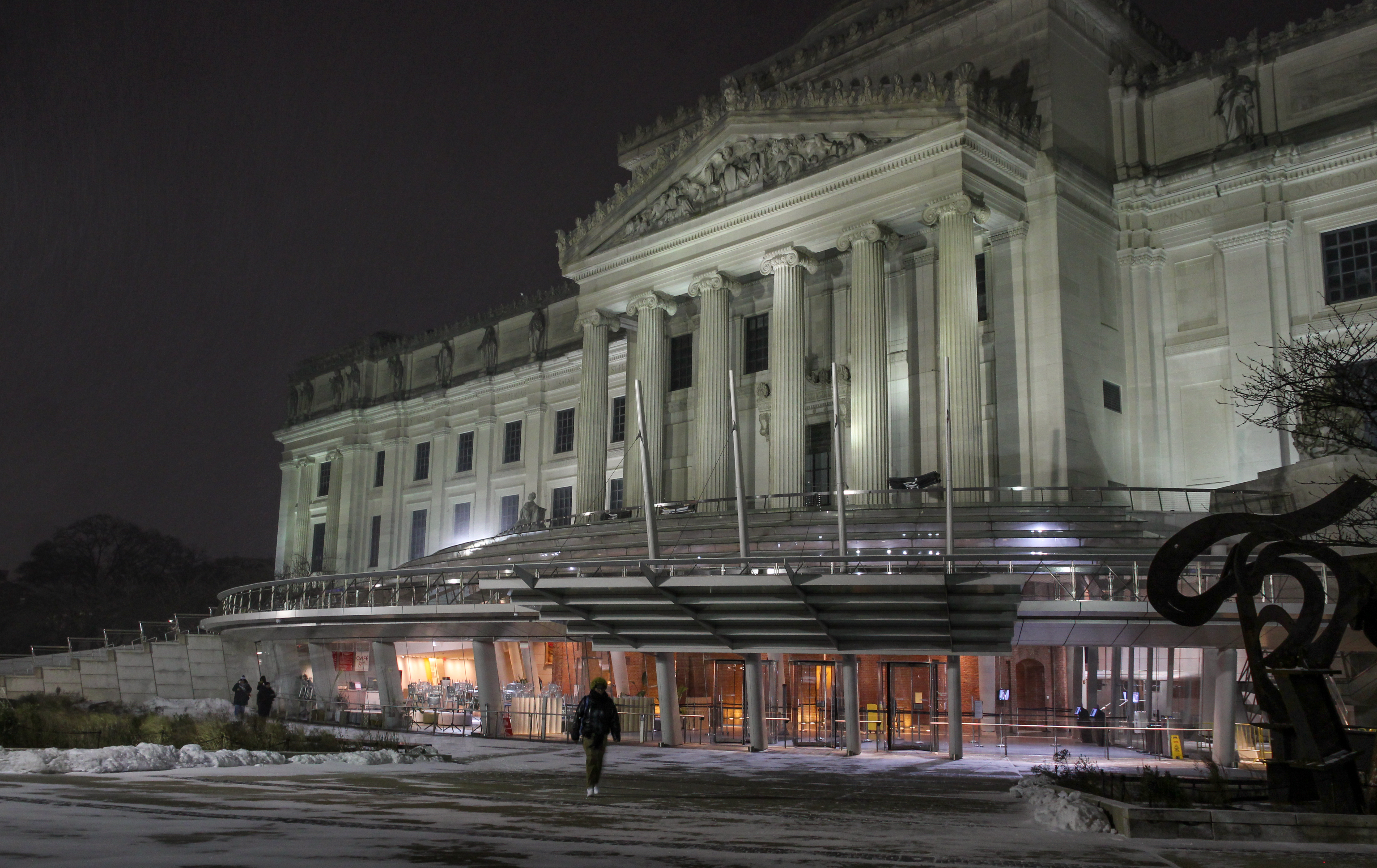 brooklyn - snow falling at night outside the brooklyn museum