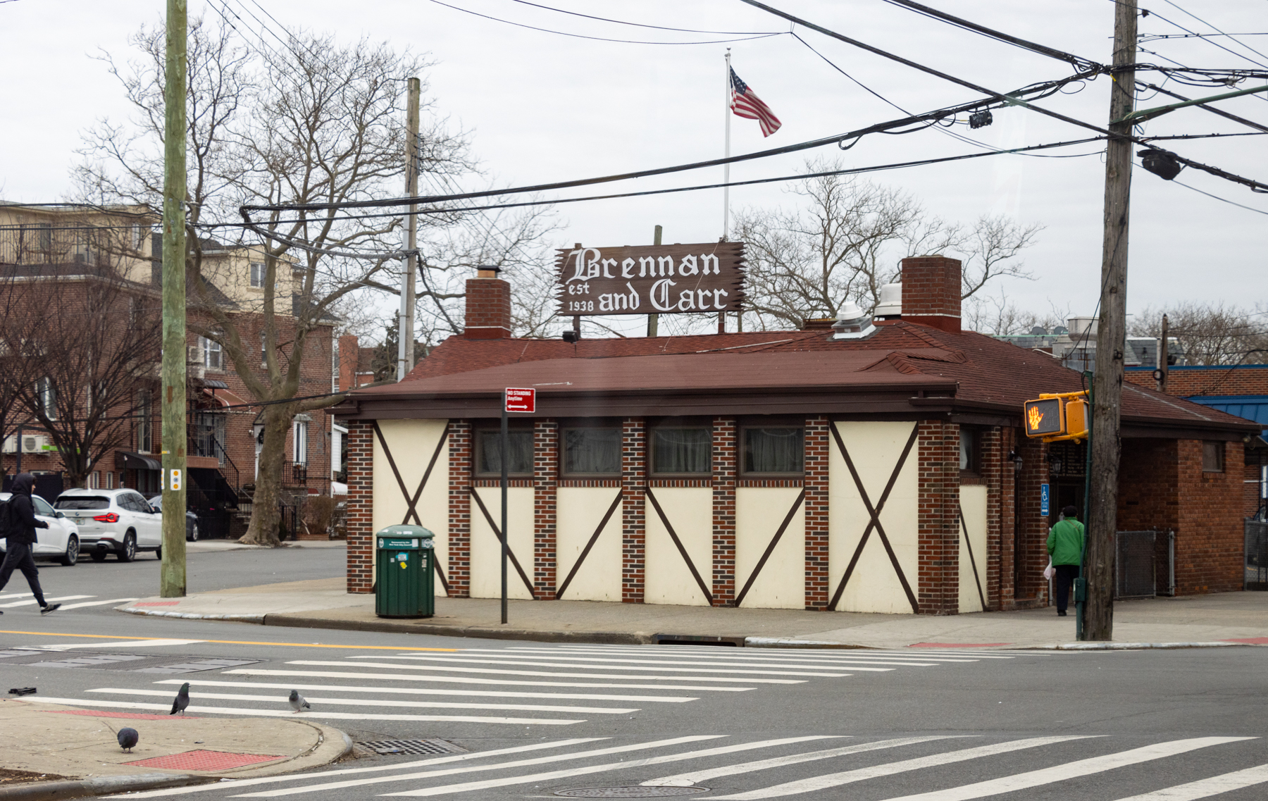 brooklyn - pedestrians and pigeons near a restaurant in sheepshead bay