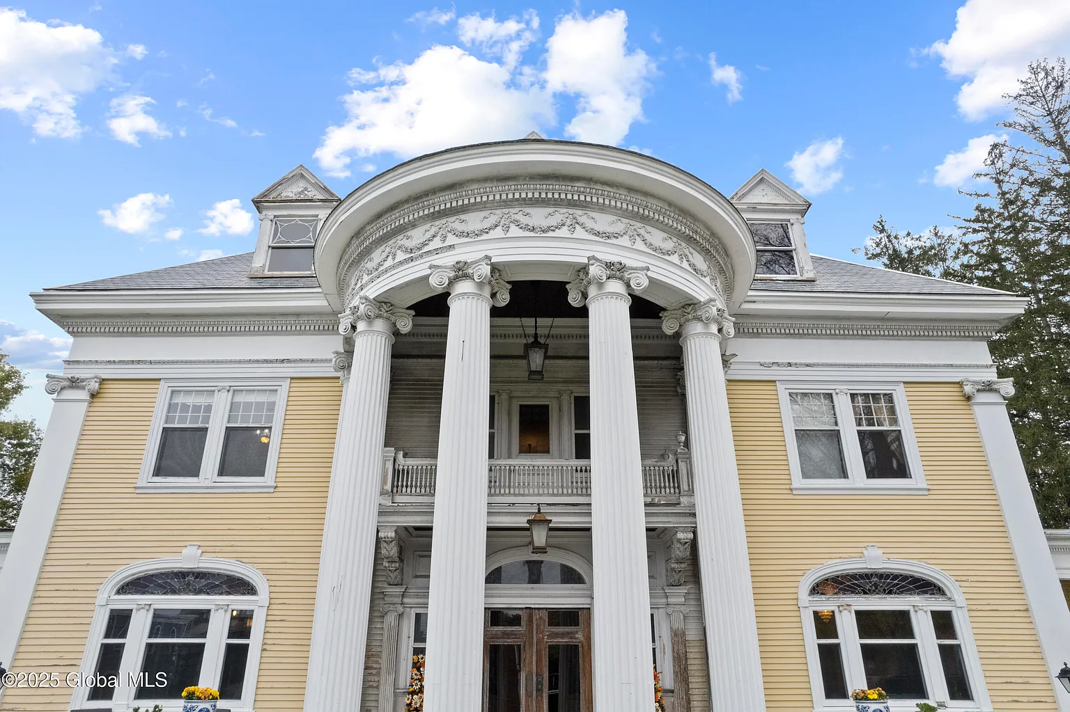 colonial revival mansion with colunmed portico