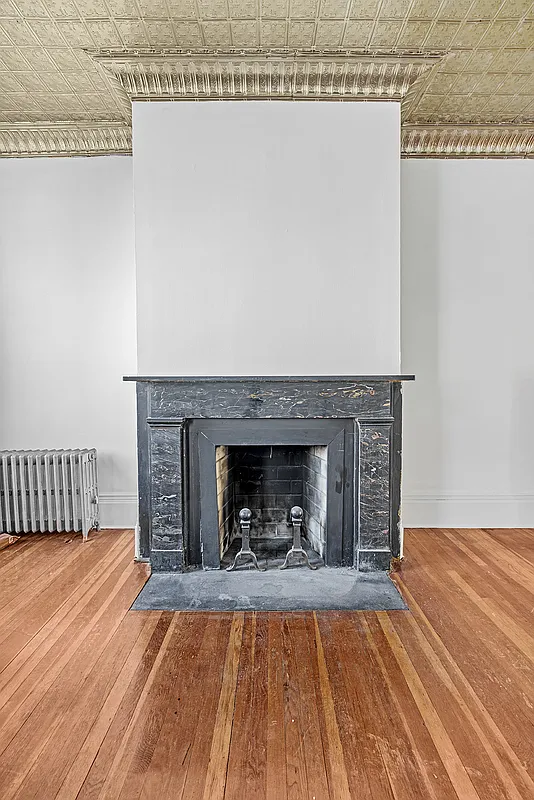 greek revival black marble mantel in the parlor