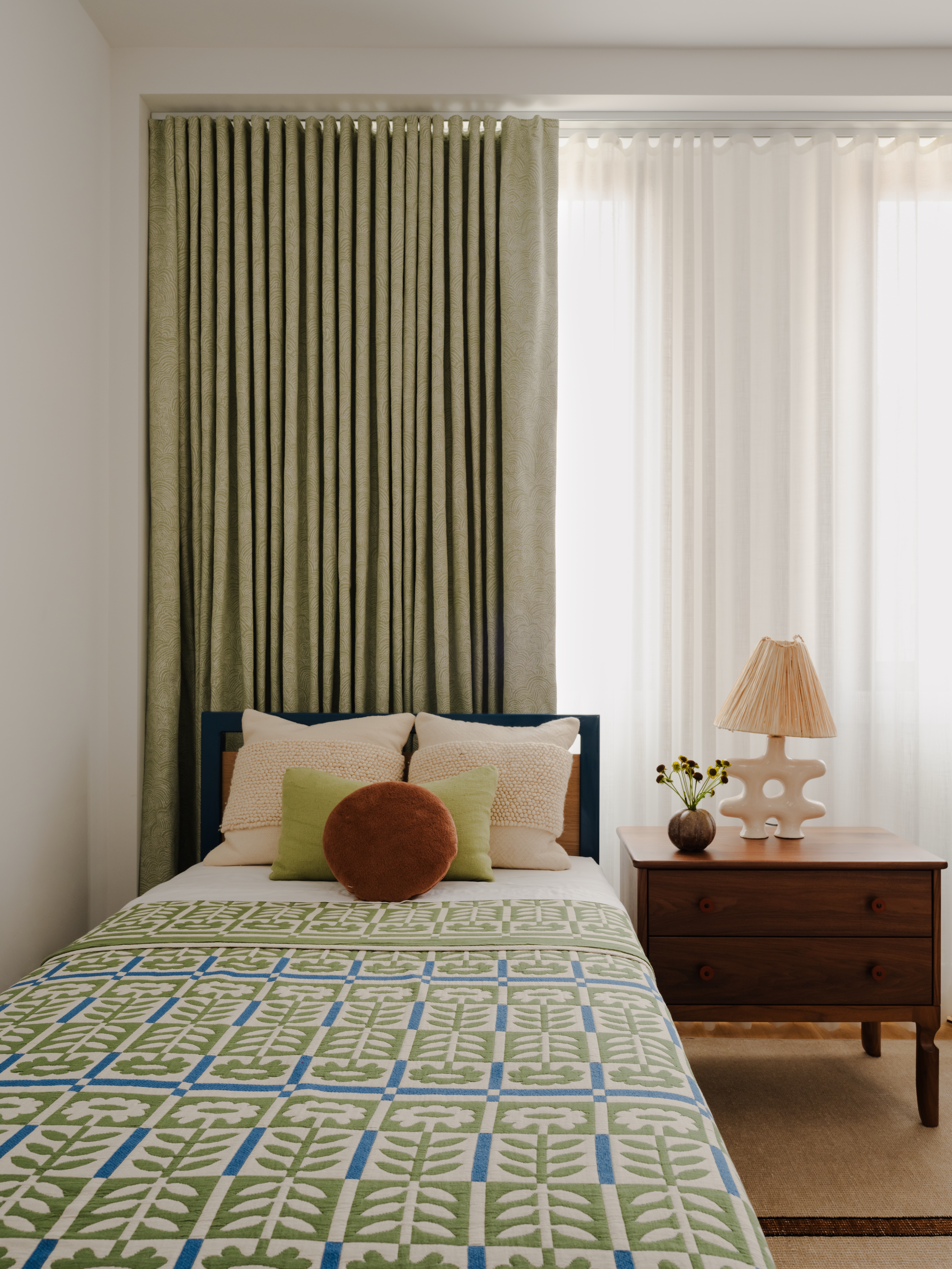 BEDROOM WITH TWIN BED GREEN LINENS