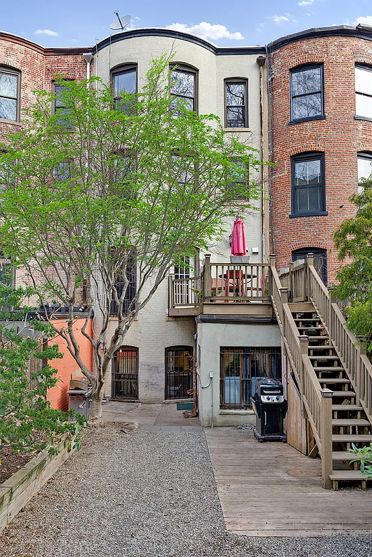 rear facade of of house with wood deck