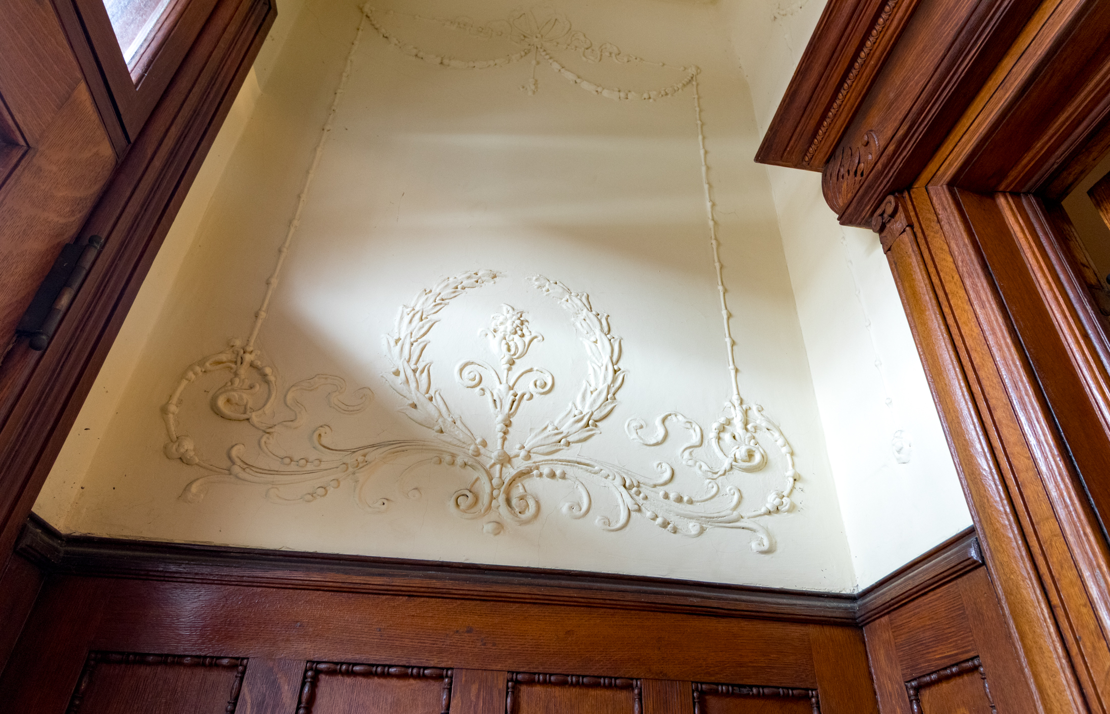 wainscoting and plaster details in an entry
