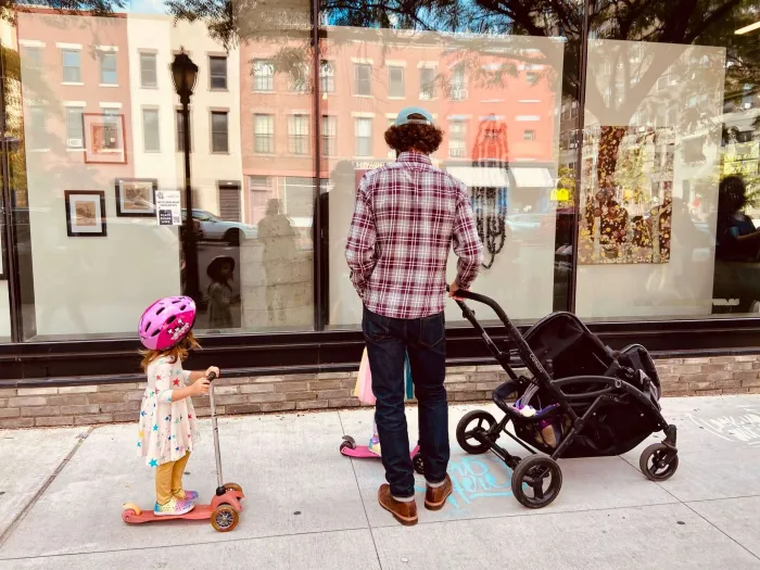 people looking at a storefront