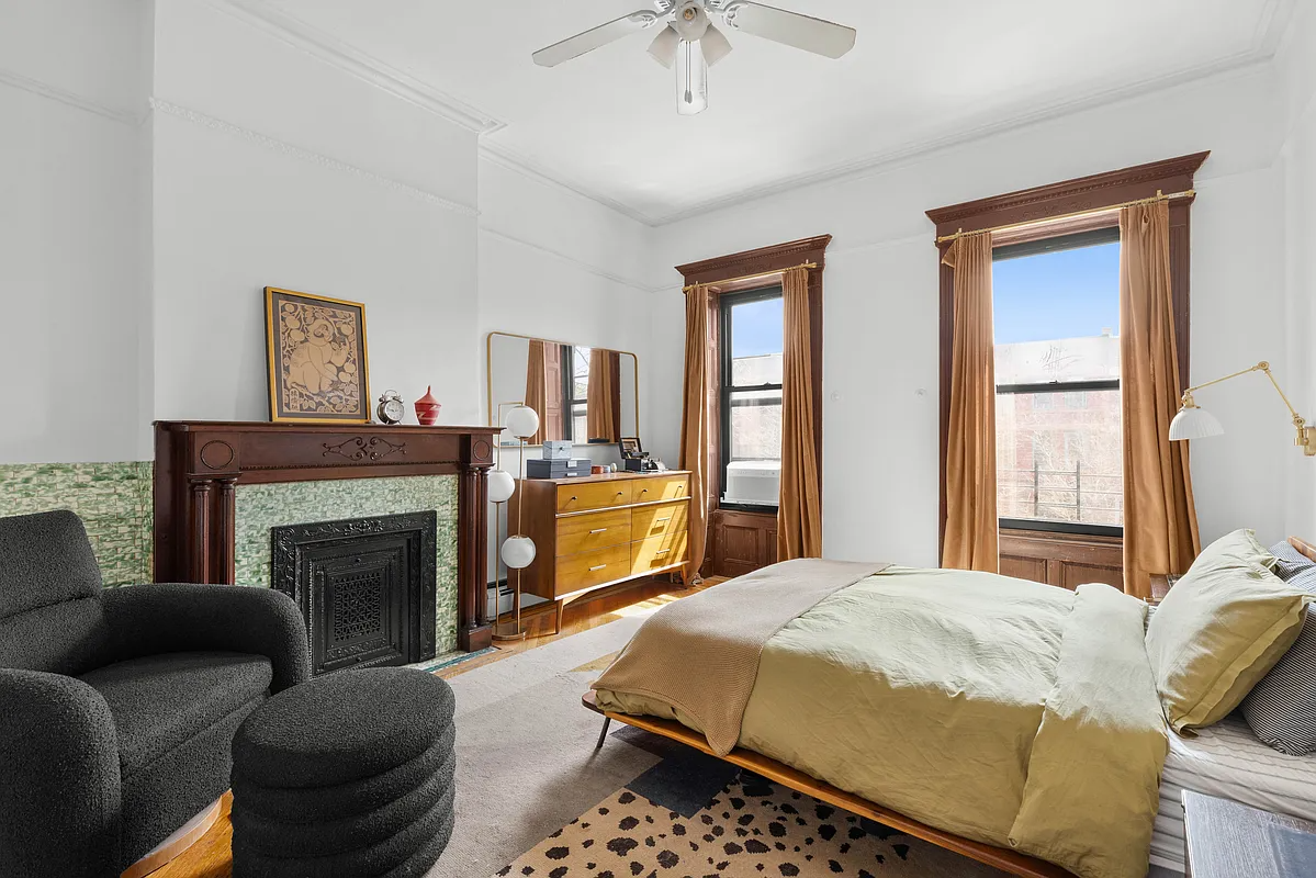 bedroom with mantel with green tile