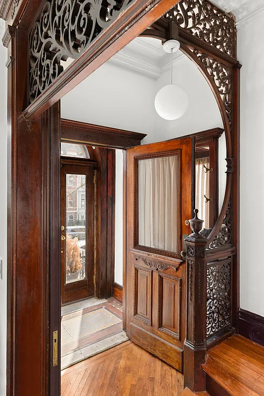 entry with fretwork, original stair