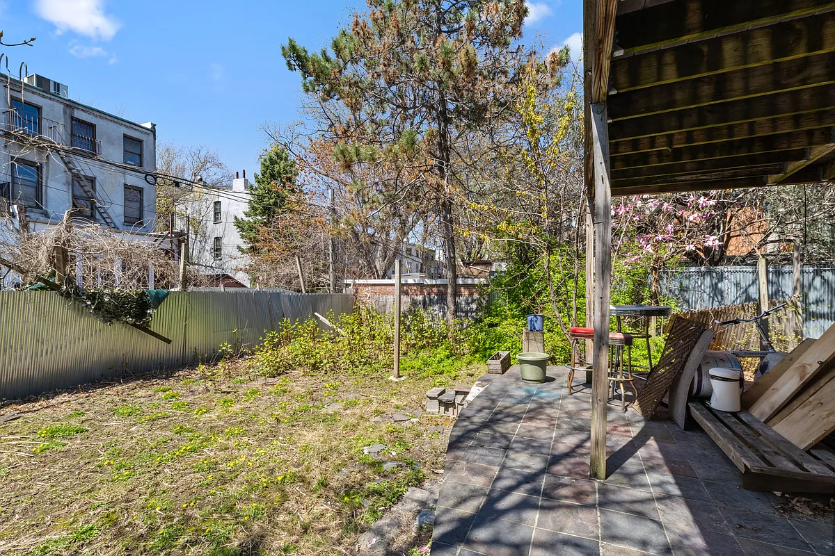 rear yard with stone patio, lawn