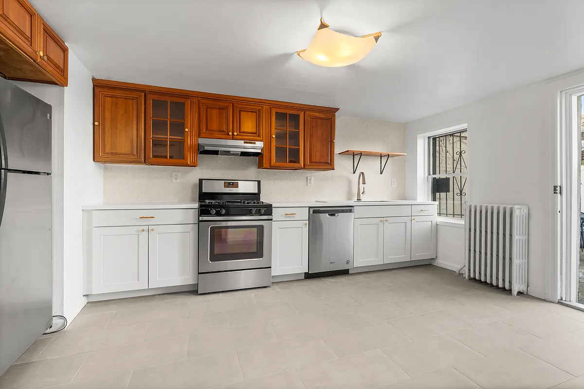 kitchen at rear of garden level with tile floor