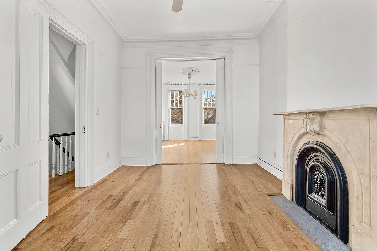 gowanus - parlor level with marble mantel, plasterwork, pocket doors